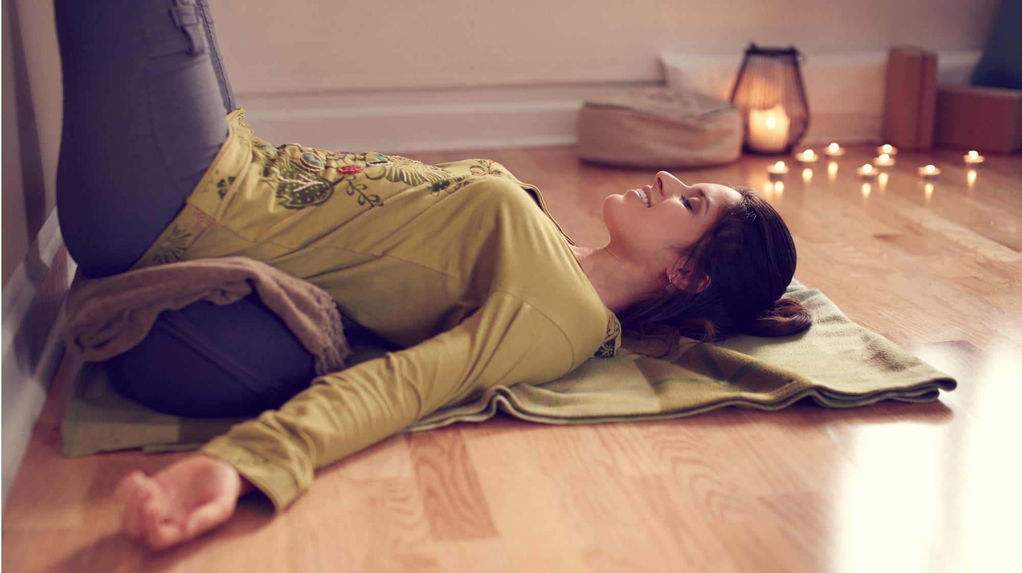 lady practicing restorative yoga
