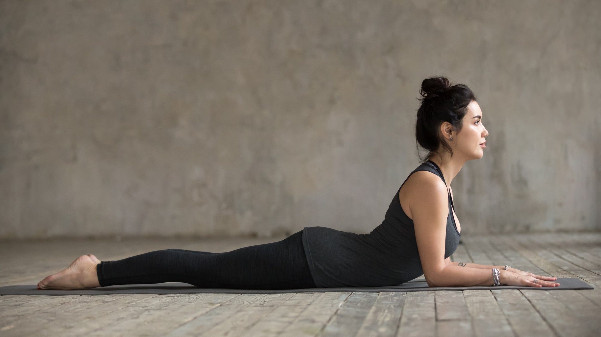 Young woman practicing yin yoga pose