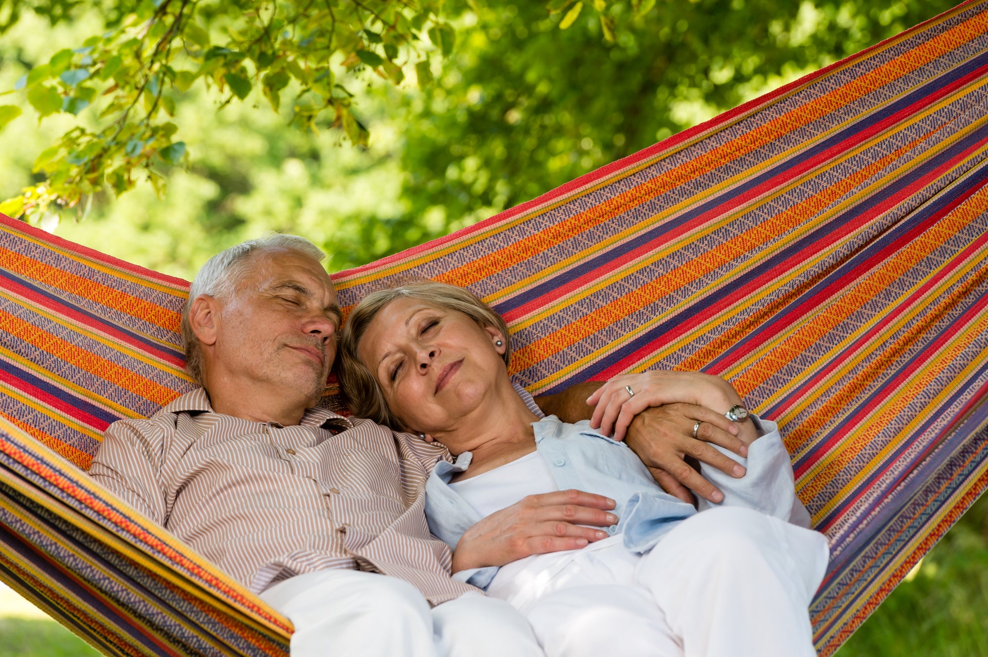 Elderly couple relaxing in a hammock