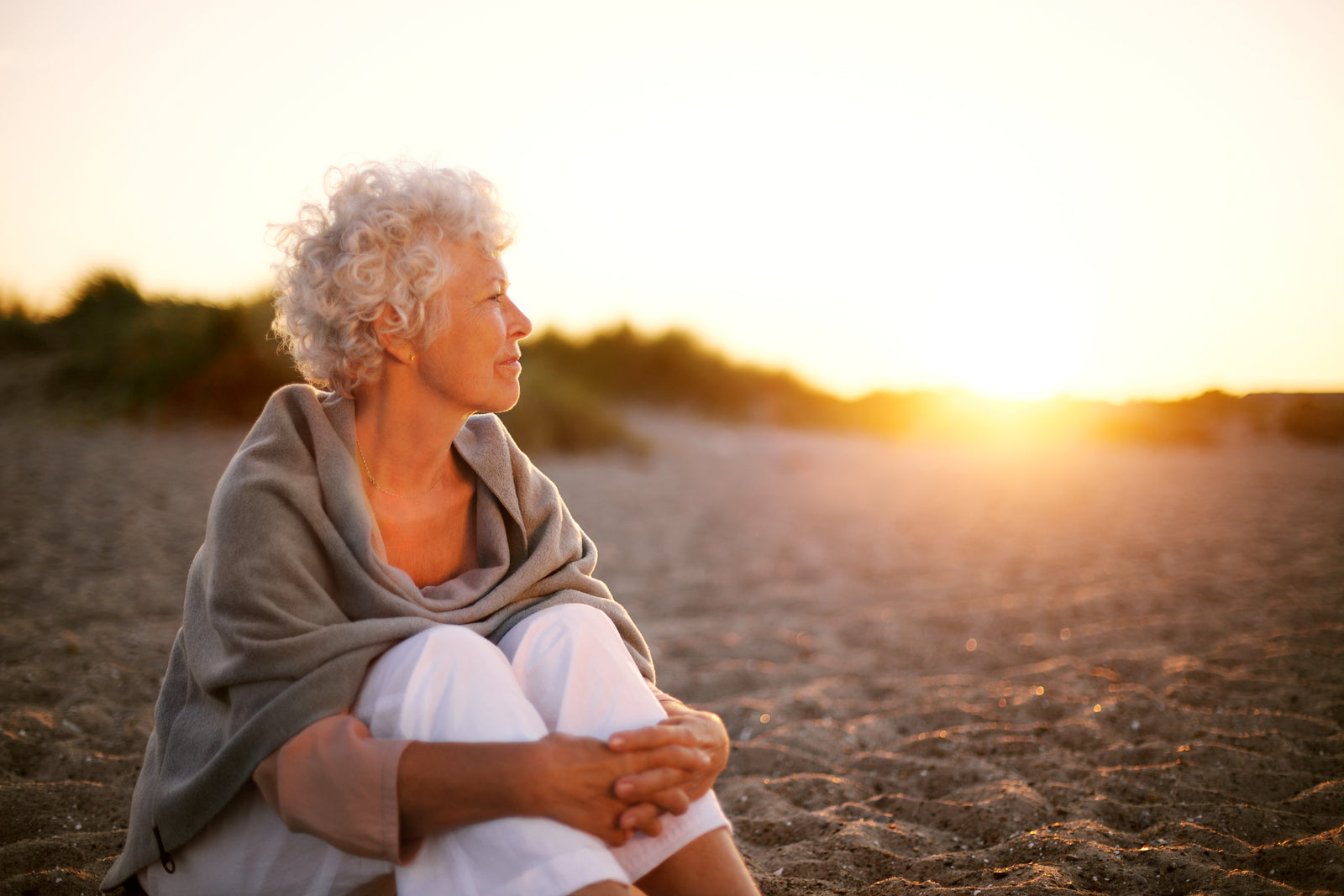 Lady sitting on the beach