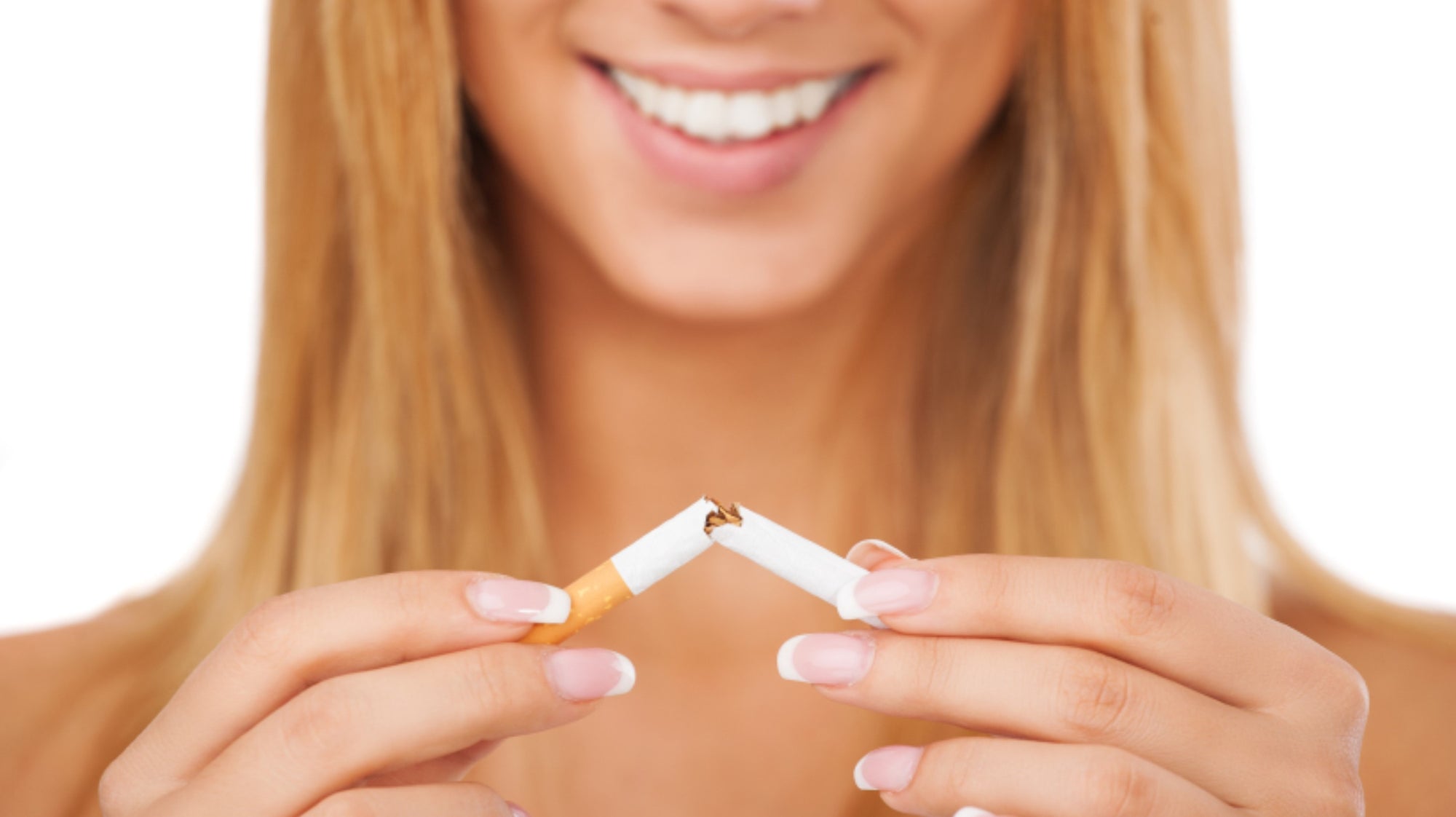Young Woman tearing cigarette in half