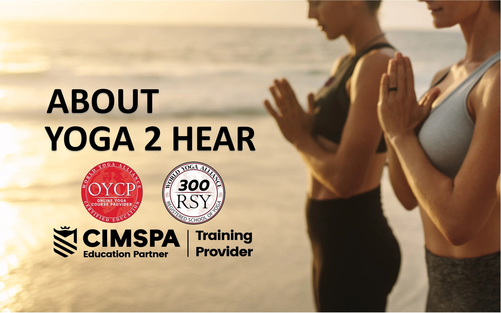 Two ladies on a beach practicing yoga standing with their hands in a prayer position.